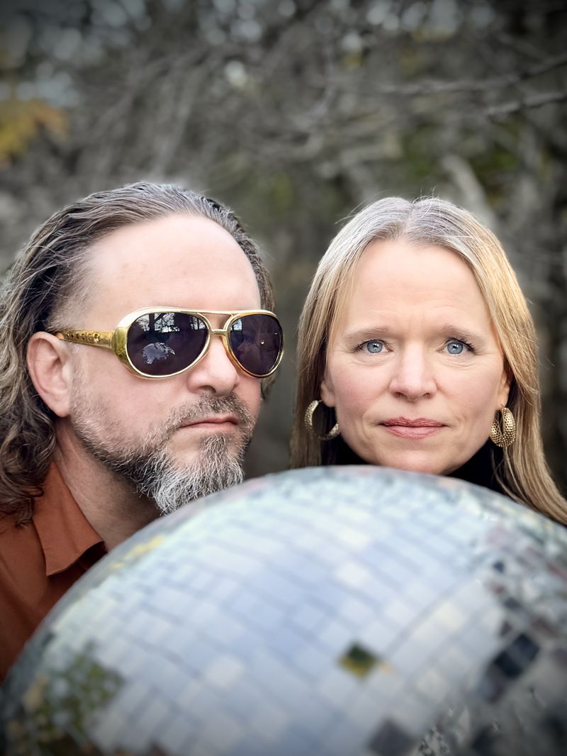 The band Love Songs and Whiskey holding a disco ball