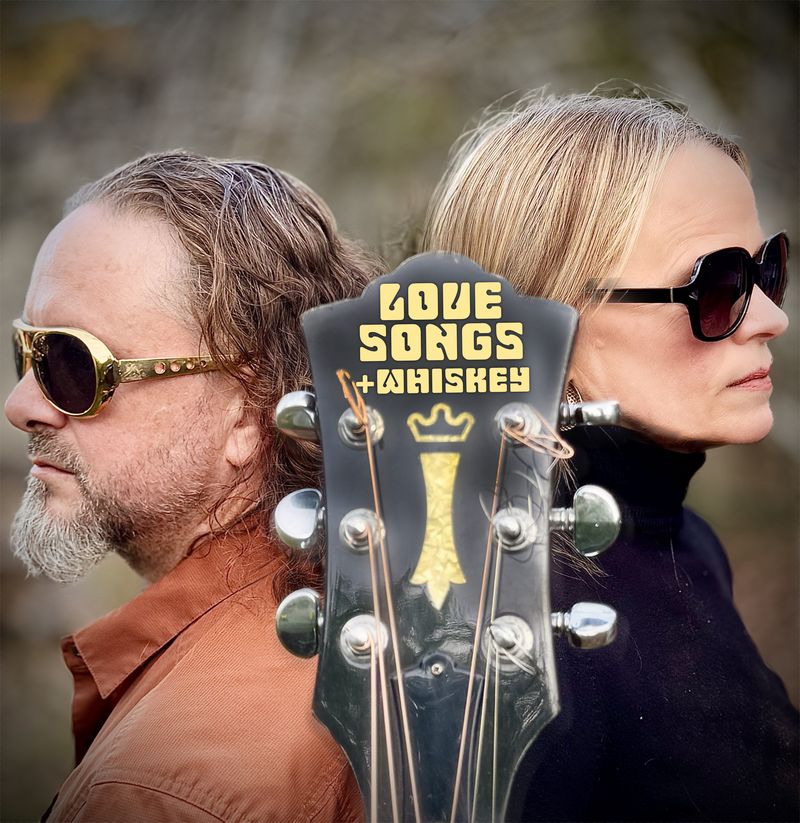 The band Love Songs & Whiskey with a guitar