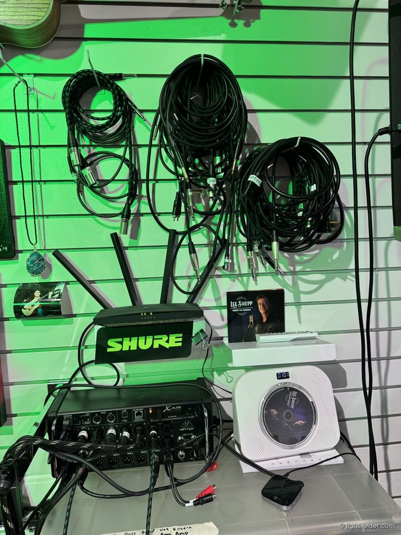 A tangle of XLR-to-TRS cables on a wall at Art Freak