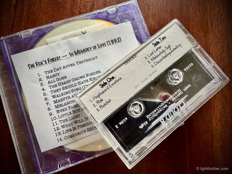 A casette tape and a home-made CDR sit on a table